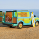 The green and blue Mystery Machine is shown near the coast.